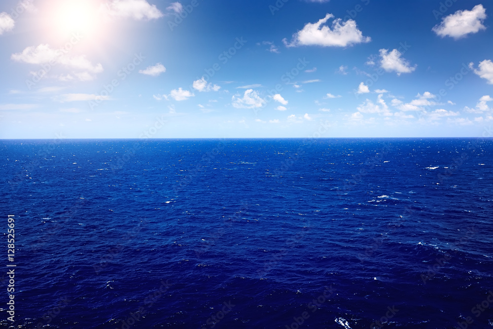 Fototapeta premium deep blue sea with blue sky and cloud