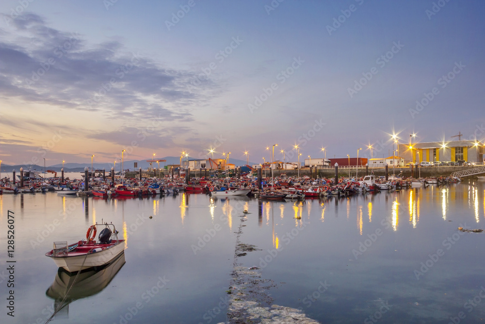 Boats moored on Xufre fishing port at night