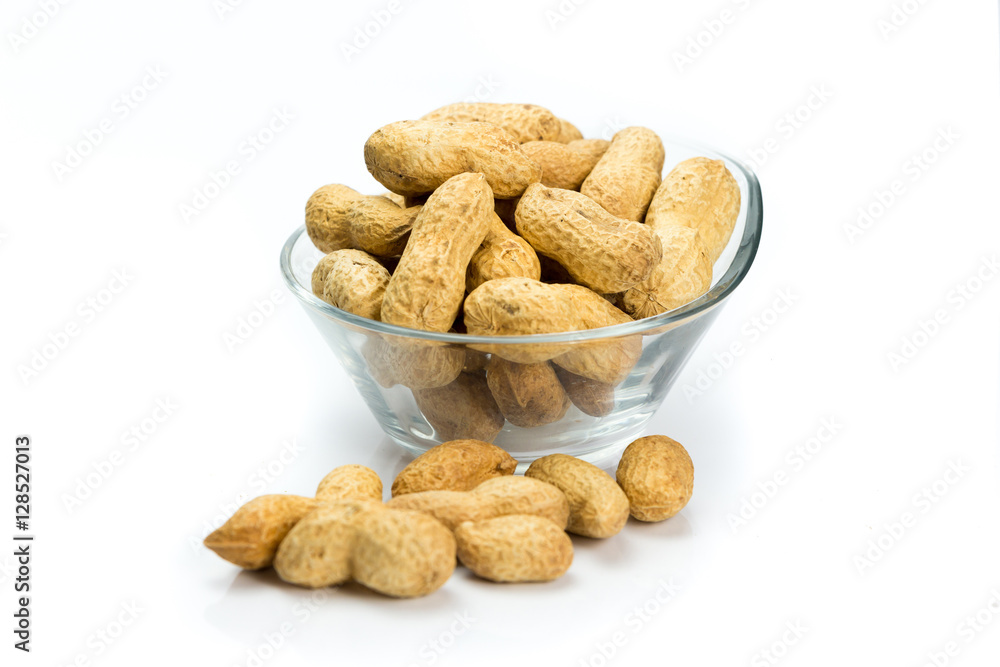 A pile of peanuts on a white background A pile of peanuts on a white background