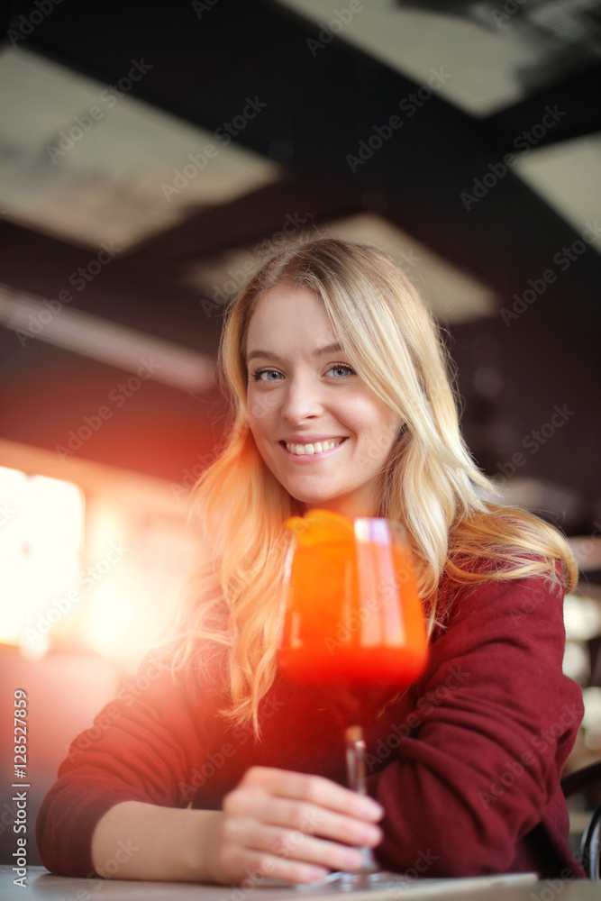Enjoying a colorful cocktail Enjoying a colorful cocktail