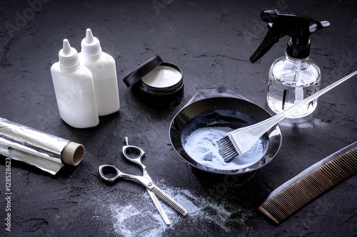 Photography hair dye with brush on dark background