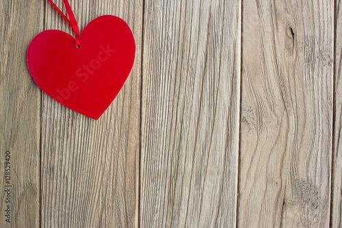 Red heart shape symbol on wooden boards. Love, Valentine's Day,