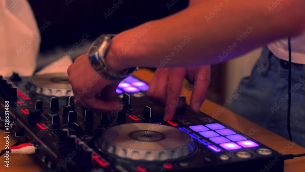 DJ plays music on console DJ plays music on console