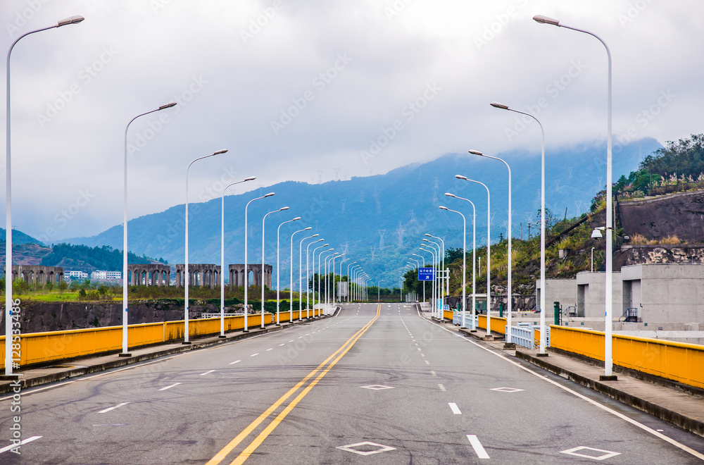 Row of street light with mountain background