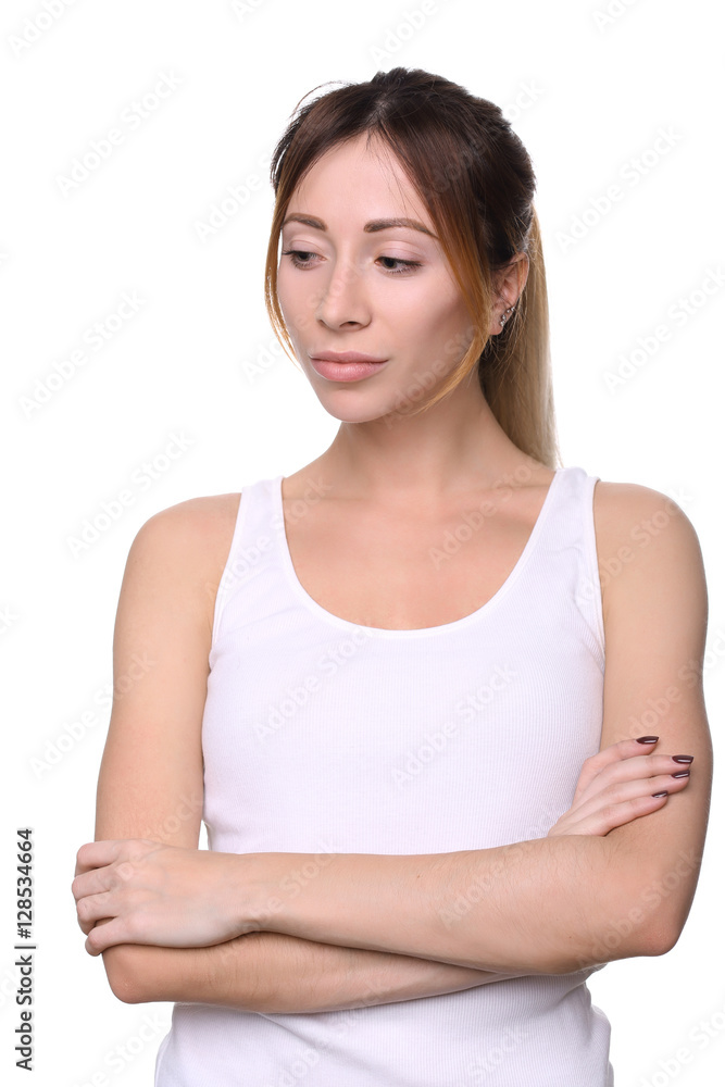 Model in tanktop with crossed arms. Close up. White background Model in tanktop with crossed arms. Close up. White background