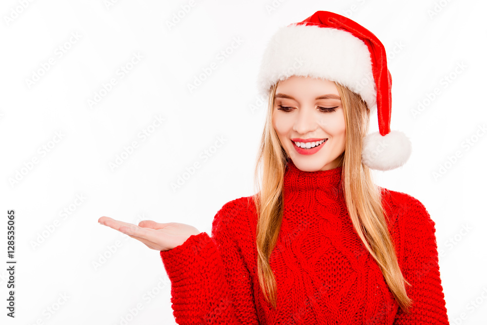 Portrait of beautiful young santa girl making advertisement Portrait of beautiful young santa girl making advertisement
