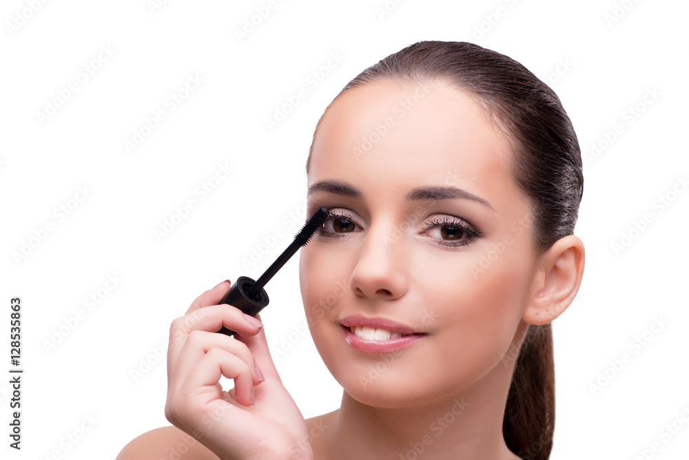 Woman brushing eyelashes isolated on white
