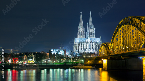 Cologne Dom and railway bridge at night.