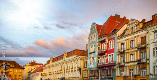 Colorful houses in Timisoara at sunset, Romania photo