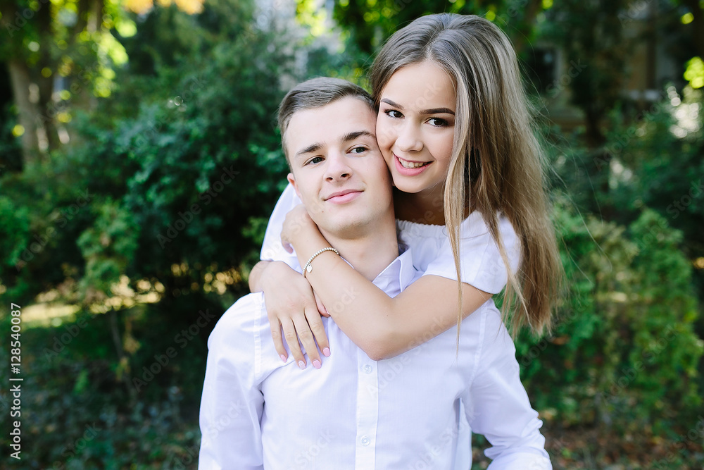 Young adult brunette man and woman in the park Young adult brunette man and woman in the park