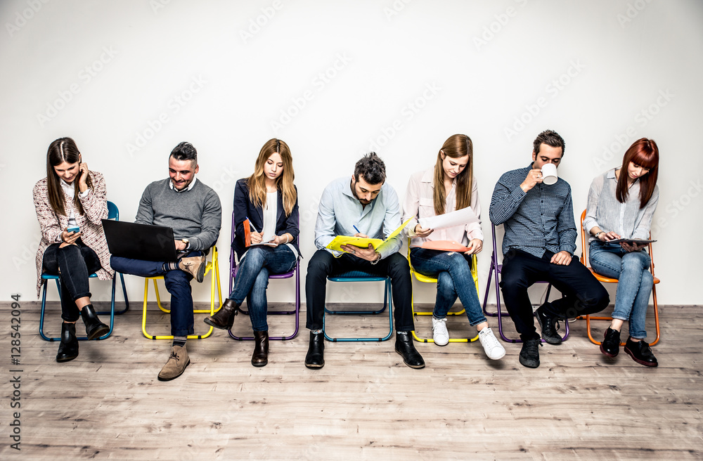 Fototapeta premium Start up people sitting in a row