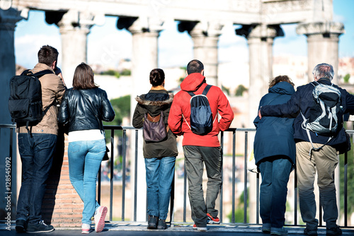couples of tourists of different ages looking at the Roman Forum photo