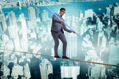 Businessman doing tightrope walking in risk concept © Elnur