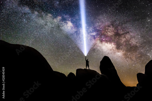 Man Flashlight Pointing Into Milky Way Galaxy