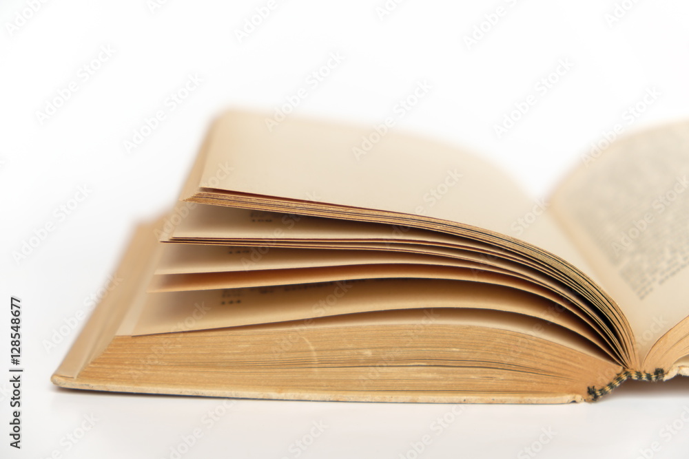 open old book closeup on white background open old book closeup on white background
