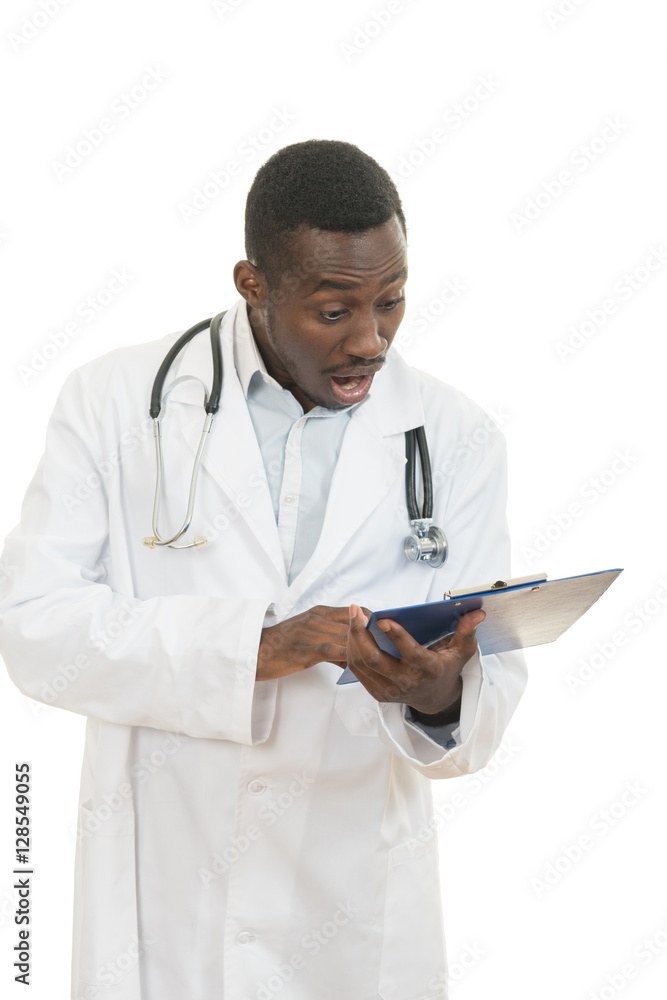 African American doctor shocked and scared by information on a clipboard. African American doctor shocked and scared by information on a clipboard.