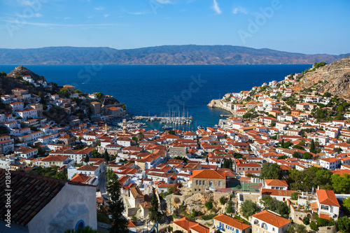 View of houses Hydra island on a Sunny day. Greece, Aegean sea.