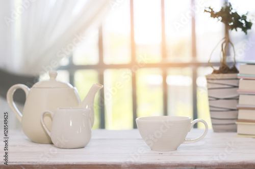 Stock Photo:.Tea set including a teacup, a teapot and a sugar bo