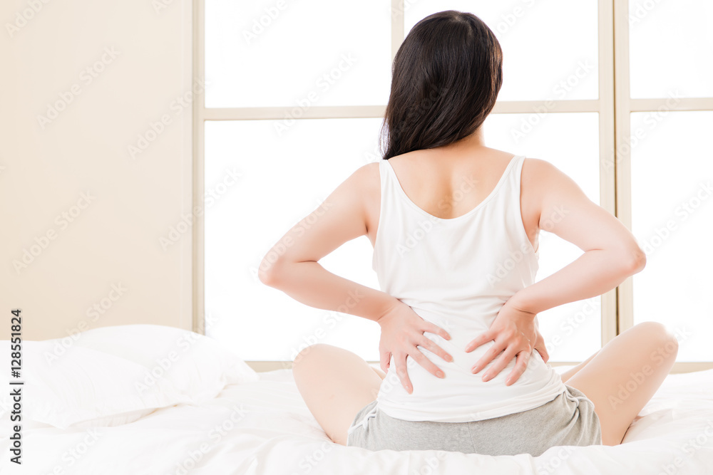 asian woman suffers back pain backache, spinal lower problem