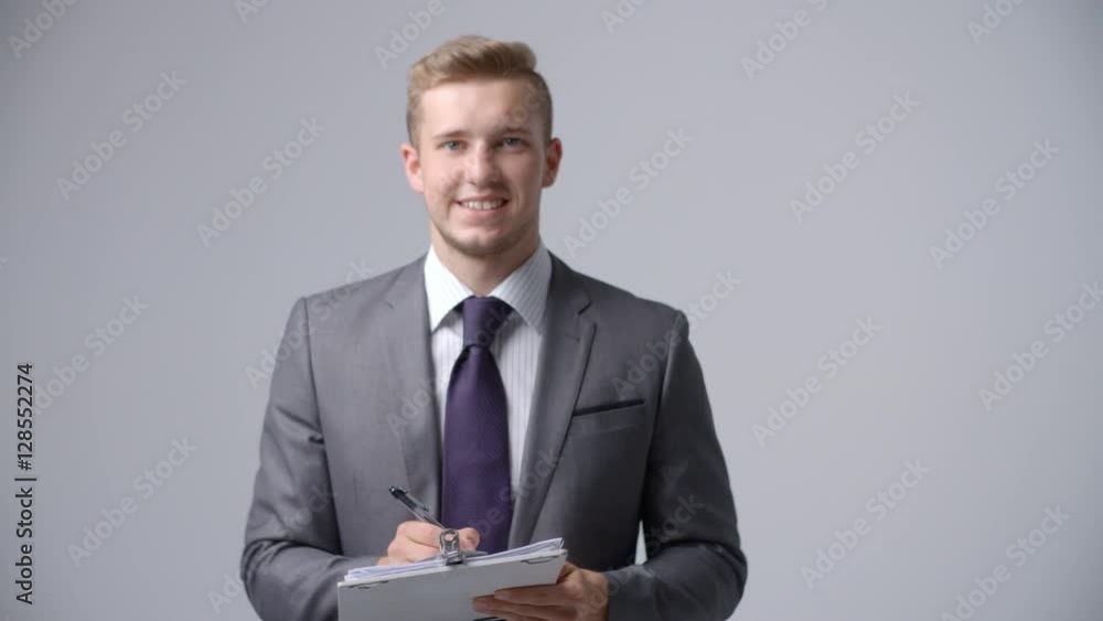 Slow Motion Sequence Of Businessman With Clipboard Slow Motion Sequence Of Businessman With Clipboard