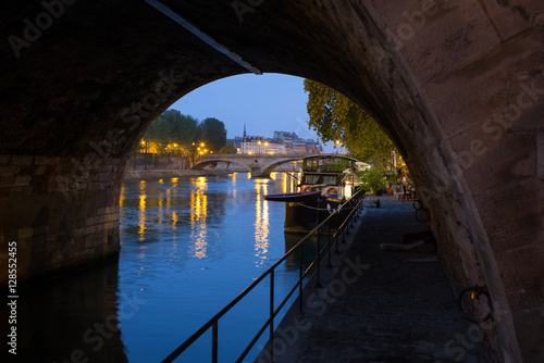 Paris under bridge on river seine