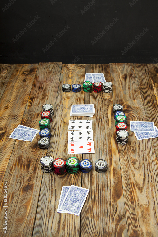 Playing poker on the old wooden table Playing poker on the old wooden table