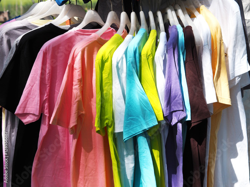 row of colorful shirt rack on clothes hanger