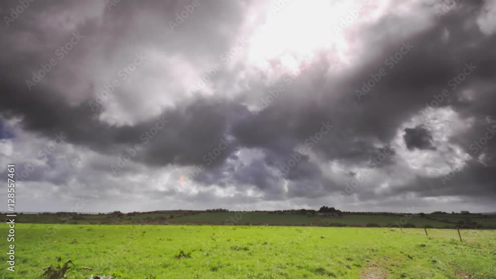 Dramatic sky over the field. Ireland landscape in summer time. Dramatic sky over the field. Ireland landscape in summer time.