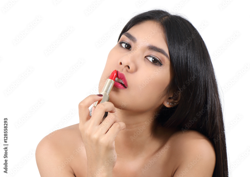 woman applying makeup woman applying makeup