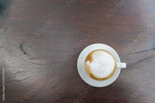 Close up white cup of Coffee, latte on the wooden table