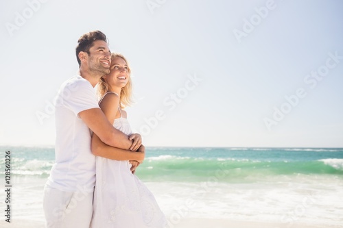 Smiling young couple hugging 