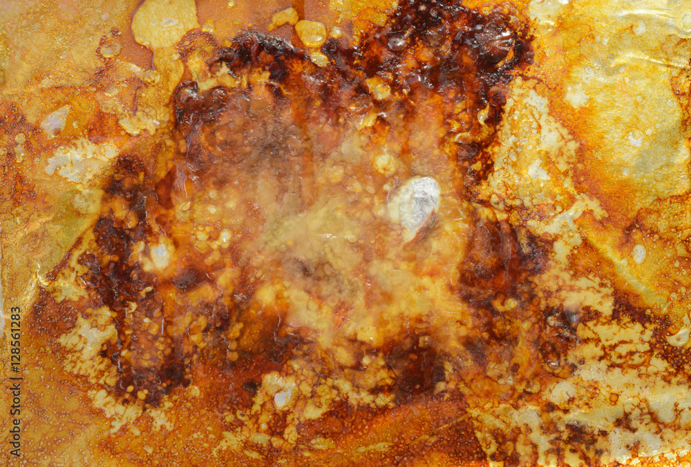 Fat and left over grease and drippings on aluminum foil from baked turkey Fat and left over grease and drippings on aluminum foil from baked turkey