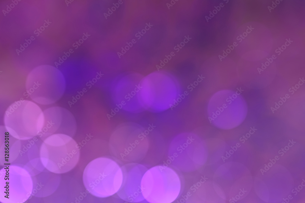 Defocused Christmas violet bokeh magic light with copy space Defocused Christmas violet bokeh magic light with copy space