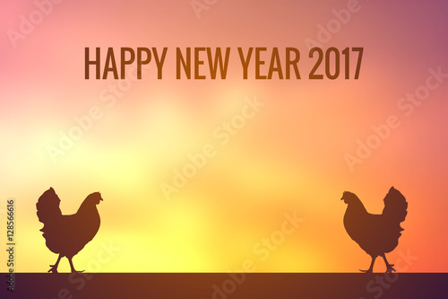 Silhouette of chicken with  2017  word at the sky sunset  Happy new year concept