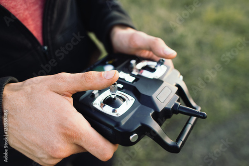 Fotografía Remote controller in male hands close-up