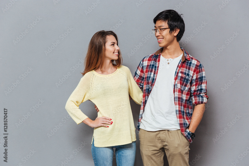 Naklejka premium Portrait of a happy interracial couple looking at each other
