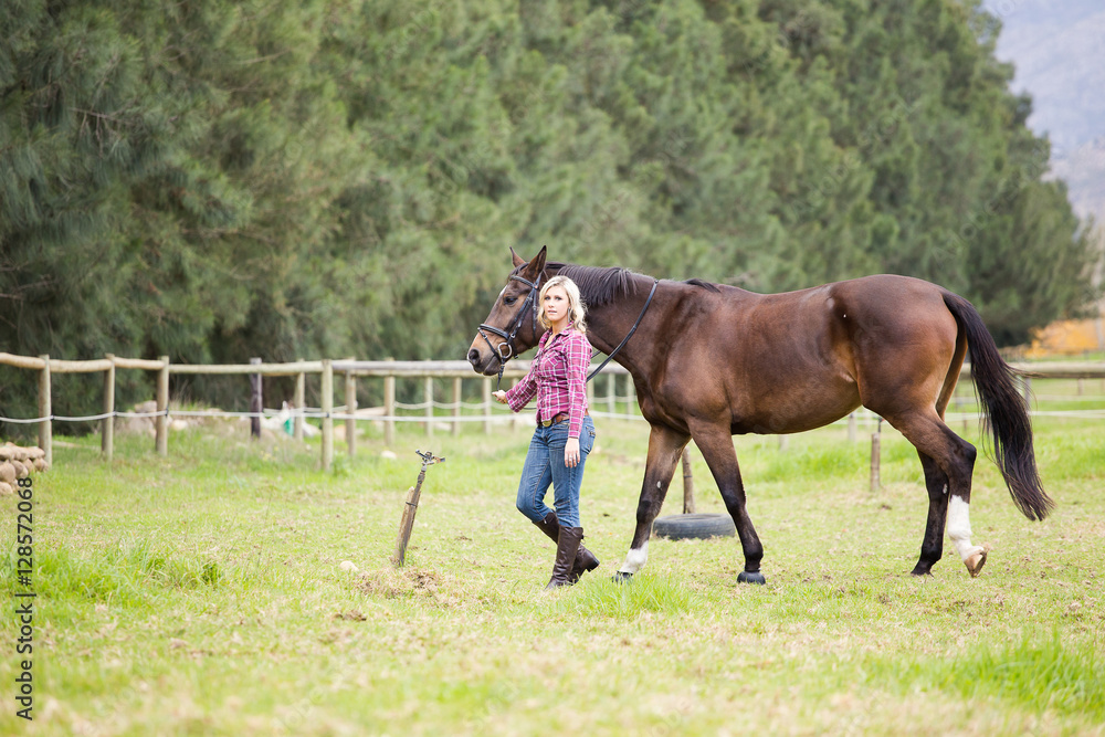 Beautiful elegance back woman cowgirl, riding a horse wearing bl Beautiful elegance back woman cowgirl, riding a horse wearing bl