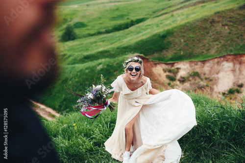 Joyful bride with glasses