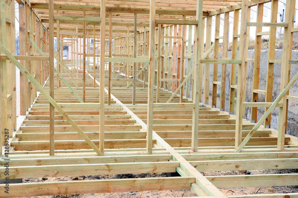 The wooden structure of the building. Wooden frame building. Connection and fastening of beams in the construction of buildings The wooden structure of the building. Wooden frame building. Connection and fastening of beams in the construction of buildings