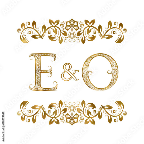 E and O vintage initials logo symbol. The letters are surrounded by ornamental elements. Wedding or business partners monogram in royal style.