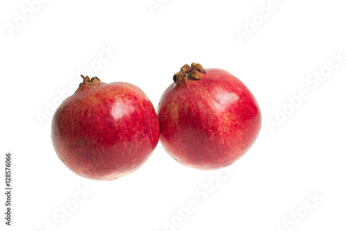 Red, juicy, ripe pomegranate isolated on a white background.