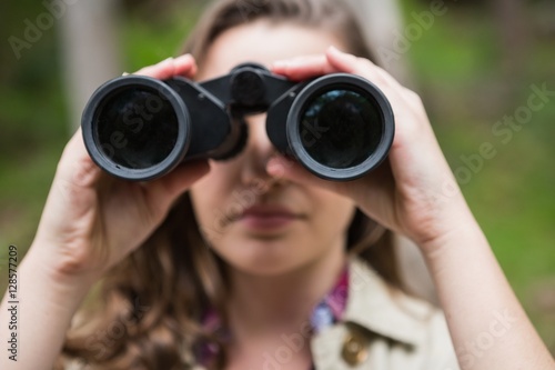 Woman using binoculars