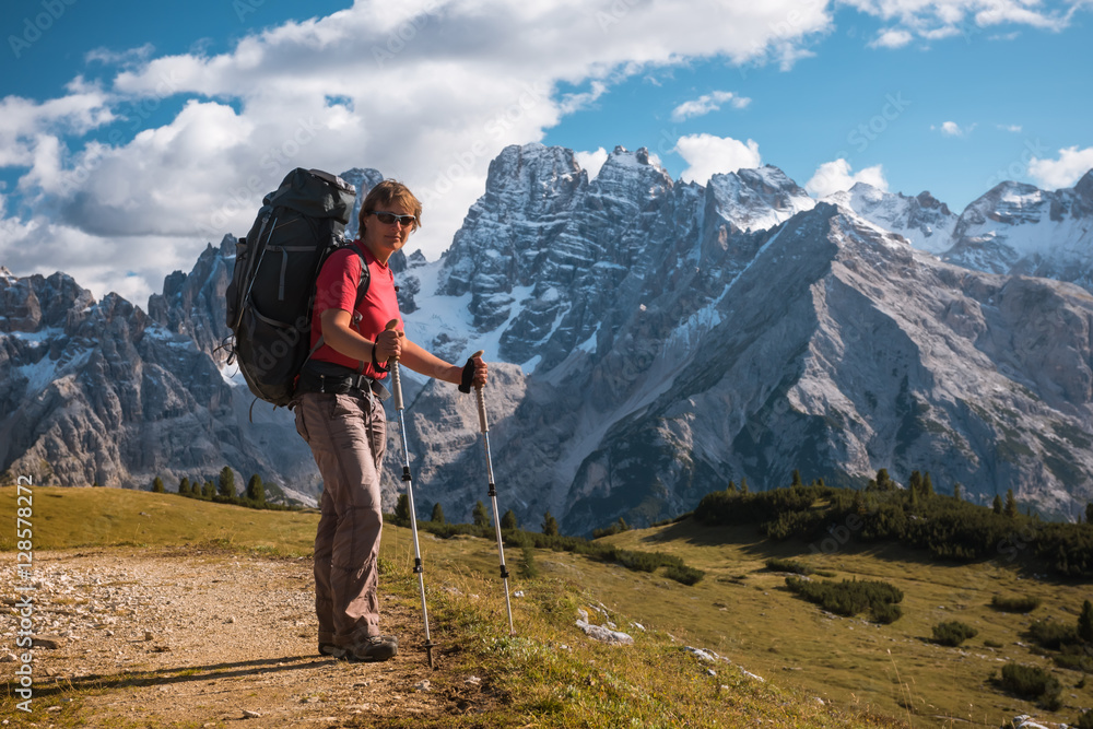hiker in front of Alps mountains hiker in front of Alps mountains