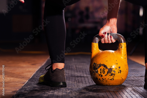 Cropped shot of female athlete with kettlebell