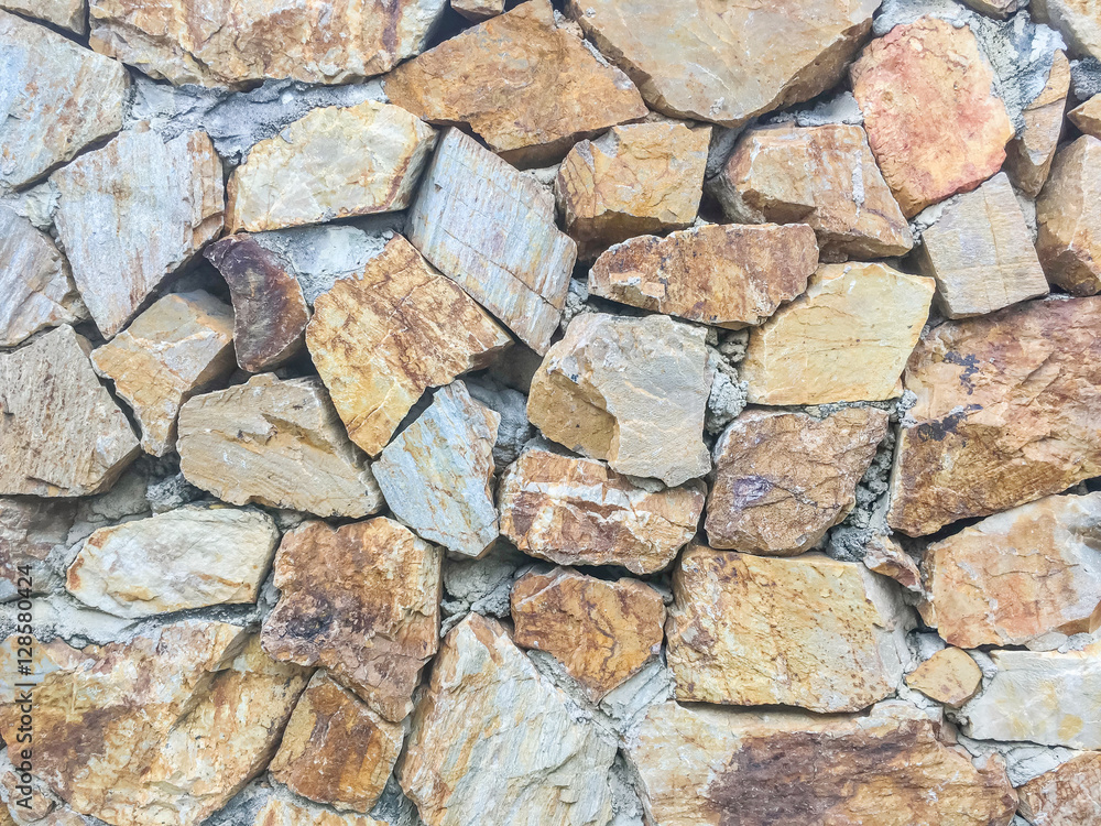 Closeup surface brick pattern at old stone brick wall textured background Closeup surface brick pattern at old stone brick wall textured background