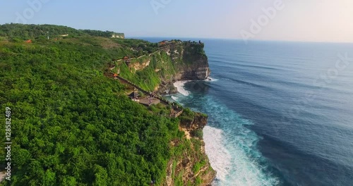 Uluwatu cliff aerial footage, Bali, Indonesia. Camera moves along the cliff