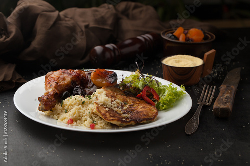 Roast chicken with couscous, spices and dried fruit
