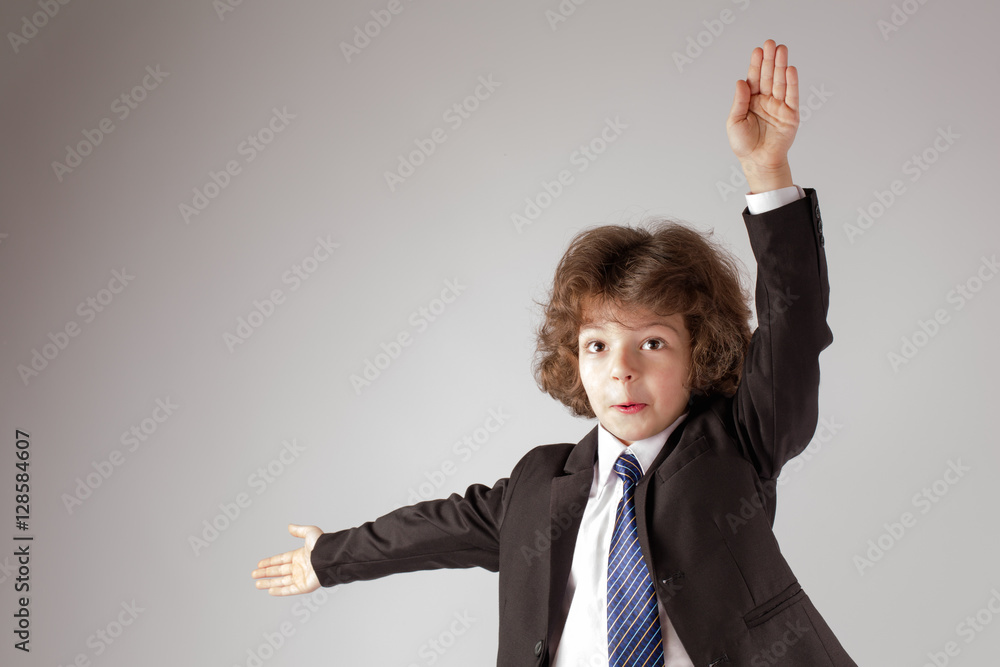 Funny curly boy teaches marine alphabet. Gray background. Funny curly boy teaches marine alphabet. Gray background.