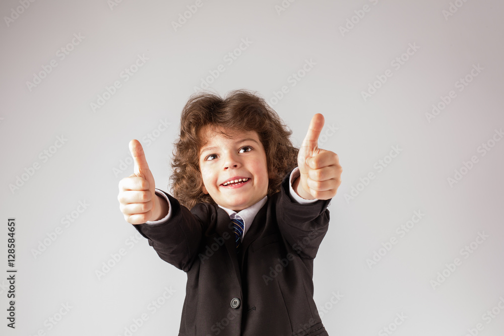 Funny curly boy stretched out his arms, smiling, and showing gesture Funny curly boy stretched out his arms, smiling, and showing gesture