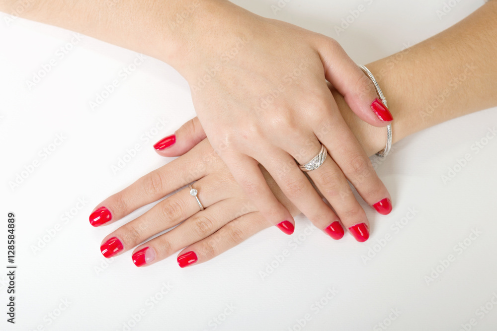 woman's hands with painted nails on a white background woman's hands with painted nails on a white background